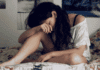 woman feeling guilty on bed