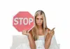 woman in bed stop sign